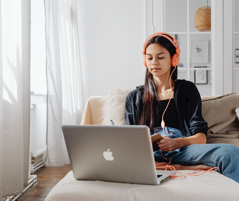 Student studying online with headphones